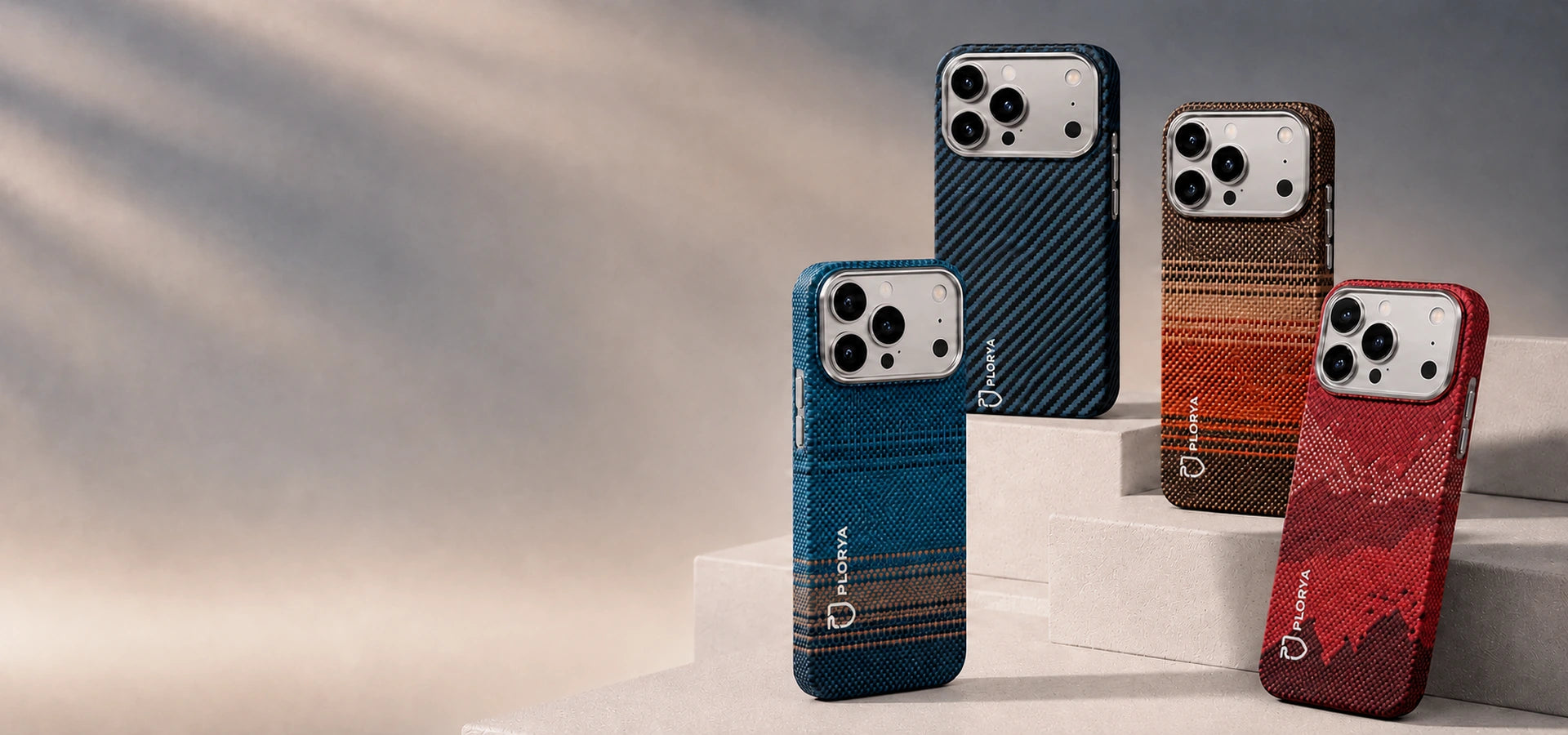 Four phone cases in different colors on a neutral background